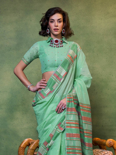 Floral inspired woven saree in cotton fabric with mint green base and tassel pallu finish. Breathable mint saree crafted in cotton spun with delicate threadwoven dots and multicolor checks.