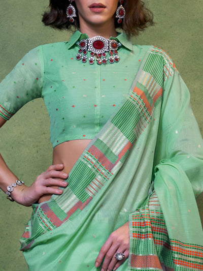 Lightweight cotton spun saree in mint green with multicolor plaid pallu and tassel edging. Cultural-ready mint green saree with woven floral border and breathable texture.