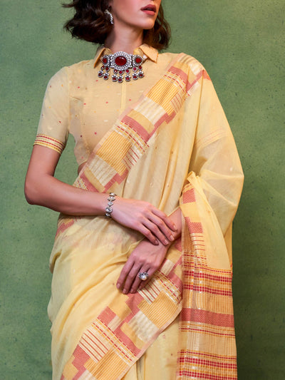 Subtle Lemon Yellow–Rust cotton saree styled with check borders and artisan-inspired floral pallu. Lemon Yellow–Rust soft spun saree with handwoven detailing across pallu and border, festive ready.