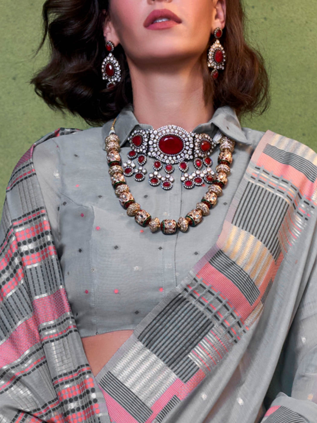 Subtle Dusty Blue–Rose cotton saree styled with check borders and artisan-inspired floral pallu. Dusty Blue–Rose soft spun saree with handwoven detailing across pallu and border, festive ready.