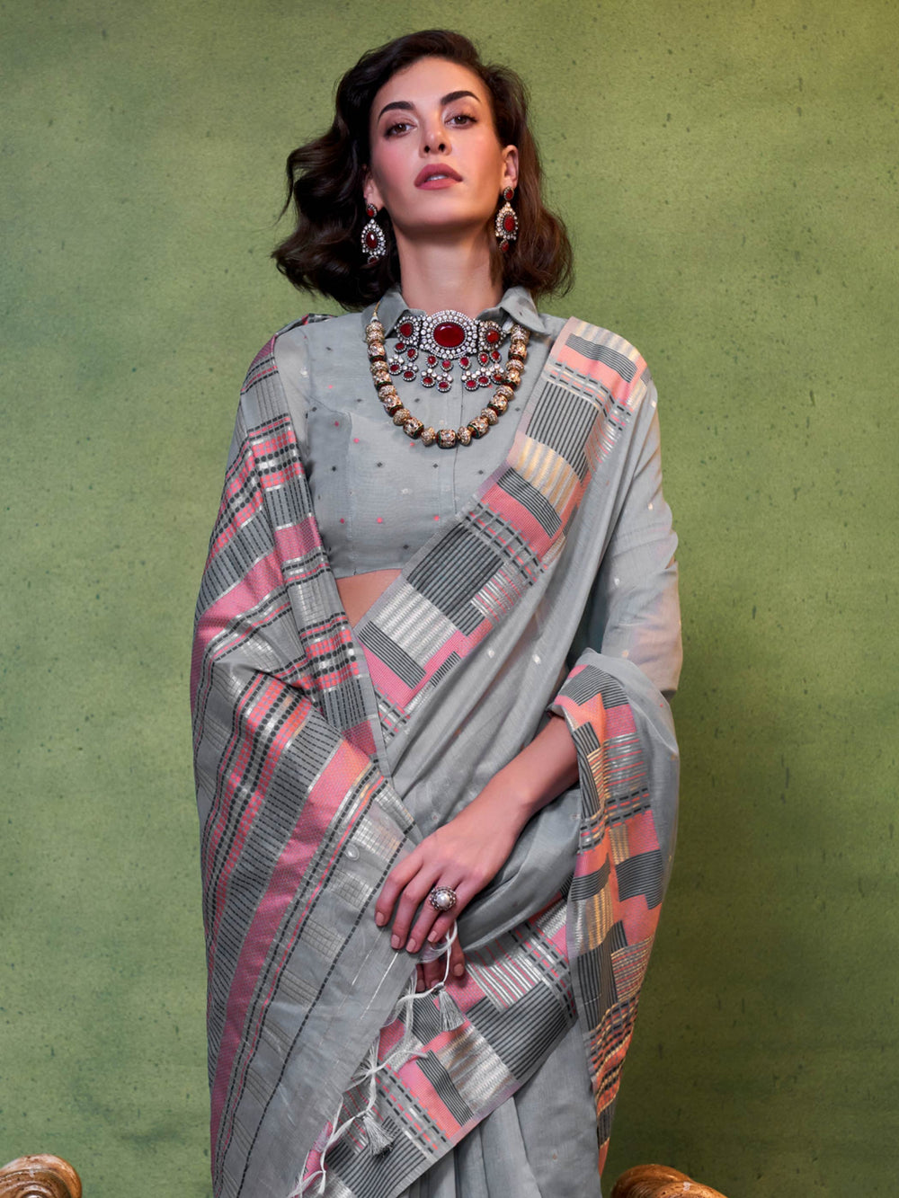 Dusty Blue–Rose festive saree featuring woven checks, tassel finish, and soft pastel elegance. Pastel Dusty Blue–Rose cotton saree for cultural daywear with minimalistic woven detailing.