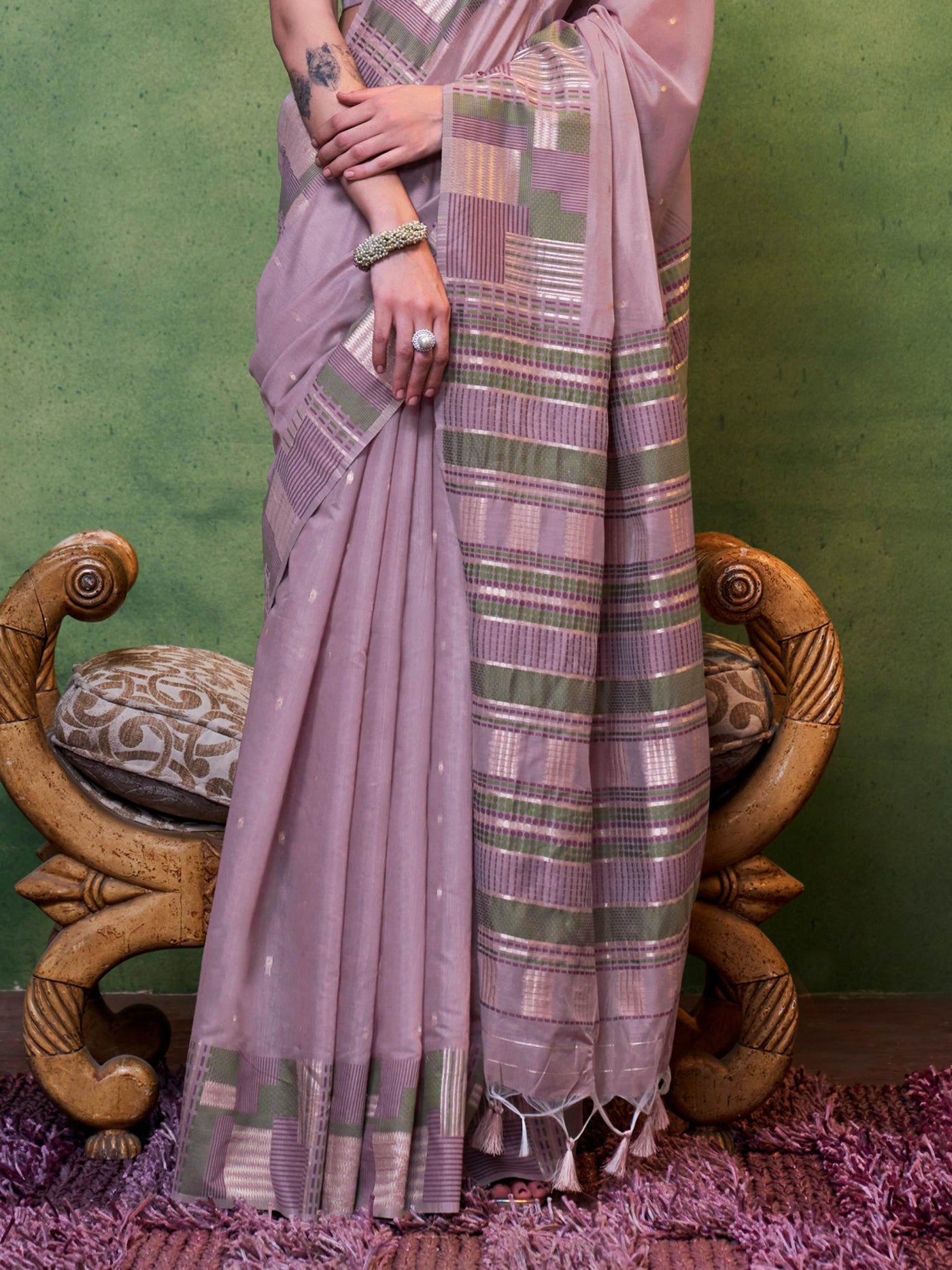 Dusty Mauve–Olive spun cotton drape with lightweight texture and floral borders for ceremonies. Dusty Mauve–Olive ethnic saree in cotton fabric, perfect for pooja, haldi or cultural meetups.
