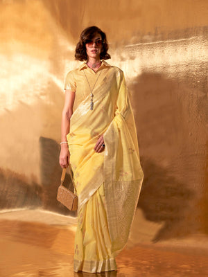 Lemon Yellow–Gold linen cotton saree with woven floral border and silver/golden pallu design. Soft Lemon Yellow–Gold saree in linen cotton featuring elegant woven motifs and jacquard styling.