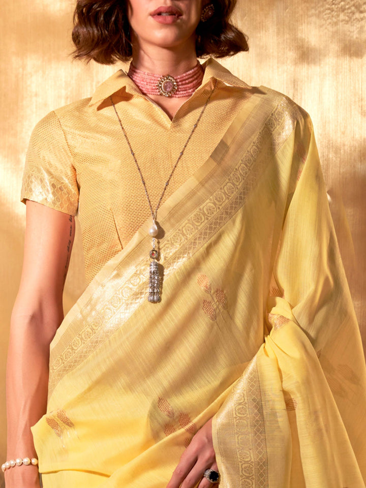 Subtle woven motifs in Lemon Yellow–Gold pastel shade with tassel pallu finish. Elegant ethnic look in Lemon Yellow–Gold with soft linen cotton drape and festive charm.