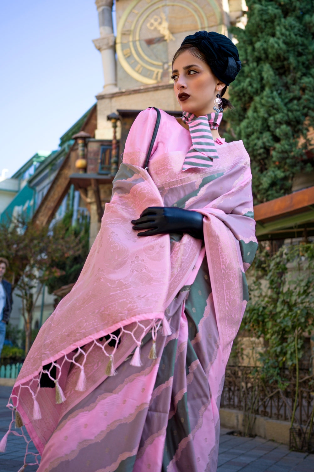 Dusty Pink and Olive Kimbus saree in rangkaat katan silk, designed with wave-striped motifs and a dramatic tassel pallu. Best styled for party-wear and fashion-forward fashion week celebrations. This image captures the zoomed texture view illustrating fabric weave and print clarity, ideal for visualizing festive elegance, designer appeal, and modern styling inspiration. Perfect for online shoppers seeking detailed previews before purchase, enhancing saree visual merchandising and SEO-rich product display st