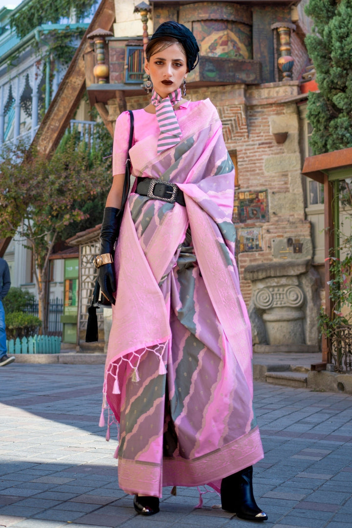 Dusty Pink and Olive Kimbus saree in rangkaat katan silk, designed with wave-striped motifs and a dramatic tassel pallu. Best styled for party-wear and fashion-forward fashion week celebrations. This image captures the front drape view highlighting pallu fall and pleats alignment, ideal for visualizing festive elegance, designer appeal, and modern styling inspiration. Perfect for online shoppers seeking detailed previews before purchase, enhancing saree visual merchandising and SEO-rich product display stra
