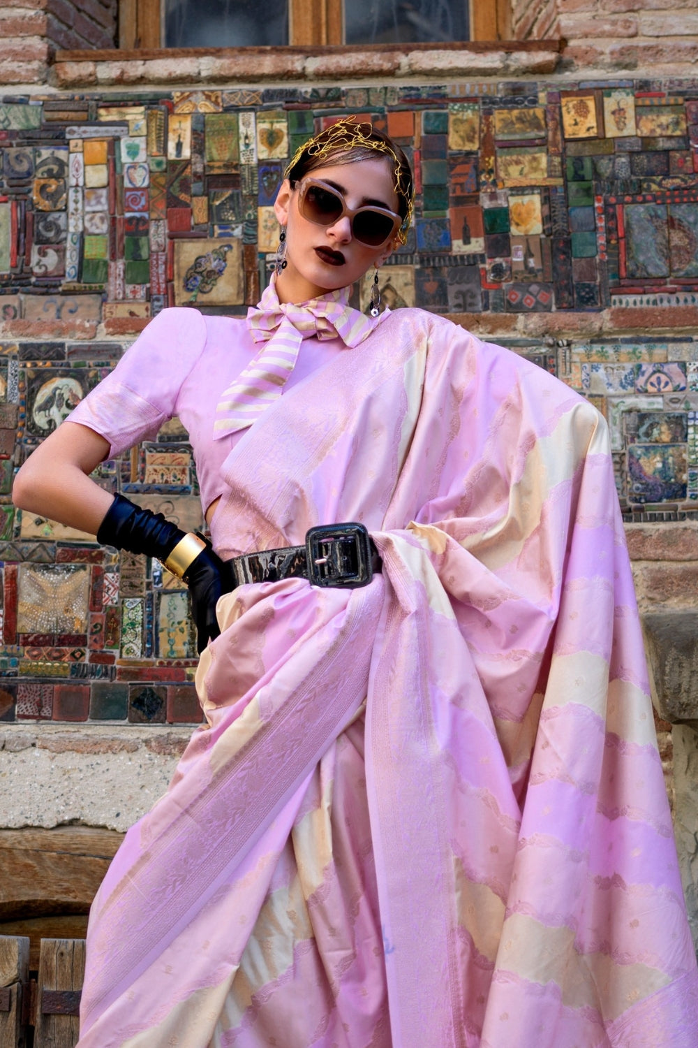 Soft Lilac and Champagne Kimbus saree in rangkaat katan silk, designed with wave-striped motifs and a dramatic tassel pallu. Best styled for party-wear and fashion-forward evening festivities celebrations. This image captures the side angle view showcasing blouse styling and zari border detail, ideal for visualizing festive elegance, designer appeal, and modern styling inspiration. Perfect for online shoppers seeking detailed previews before purchase, enhancing saree visual merchandising and SEO-rich produc