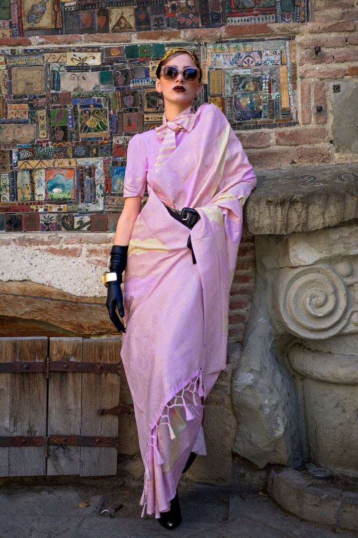 Soft Lilac and Champagne Kimbus saree in rangkaat katan silk, designed with wave-striped motifs and a dramatic tassel pallu. Best styled for party-wear and fashion-forward evening festivities celebrations. This image captures the front drape view highlighting pallu fall and pleats alignment, ideal for visualizing festive elegance, designer appeal, and modern styling inspiration. Perfect for online shoppers seeking detailed previews before purchase, enhancing saree visual merchandising and SEO-rich product d