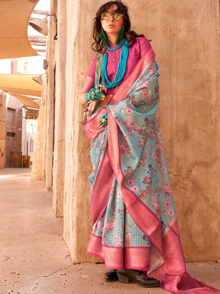 This Sky Blue–Magenta FeatherSoft saree features stunning printed floral work with floral detailing and grid textures, ideal for festive evenings and cocktail-ready styling. Designed for lightweight elegance and statement draping. SKU 376006. This Sky Blue–Magenta FeatherSoft saree features stunning printed floral work with floral detailing and grid textures, ideal for festive evenings and cocktail-ready styling. Designed for lightweight elegance and statement draping. SKU 376006.