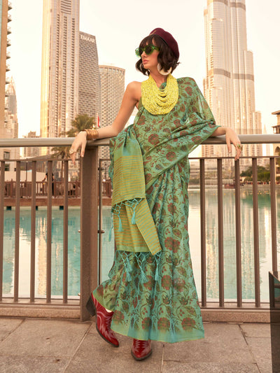 Sea Green and Golden zari tissue saree with printed floral motifs and zari pallu This image captures the front drape view highlighting pallu fall and pleats alignment, ideal for visualizing festive elegance, designer appeal, and modern styling inspiration. Perfect for online shoppers seeking detailed previews before purchase, enhancing saree visual merchandising and SEO-rich product display strategy.                                                                                                             