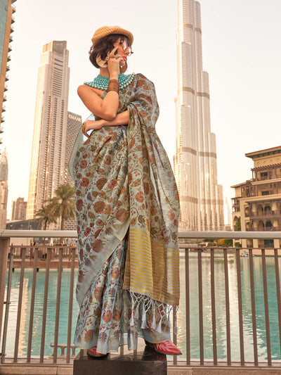 Powder Blue and Ivory zari tissue saree with printed floral motifs and zari pallu This image captures the front drape view highlighting pallu fall and pleats alignment, ideal for visualizing festive elegance, designer appeal, and modern styling inspiration. Perfect for online shoppers seeking detailed previews before purchase, enhancing saree visual merchandising and SEO-rich product display strategy.                                                                                                            