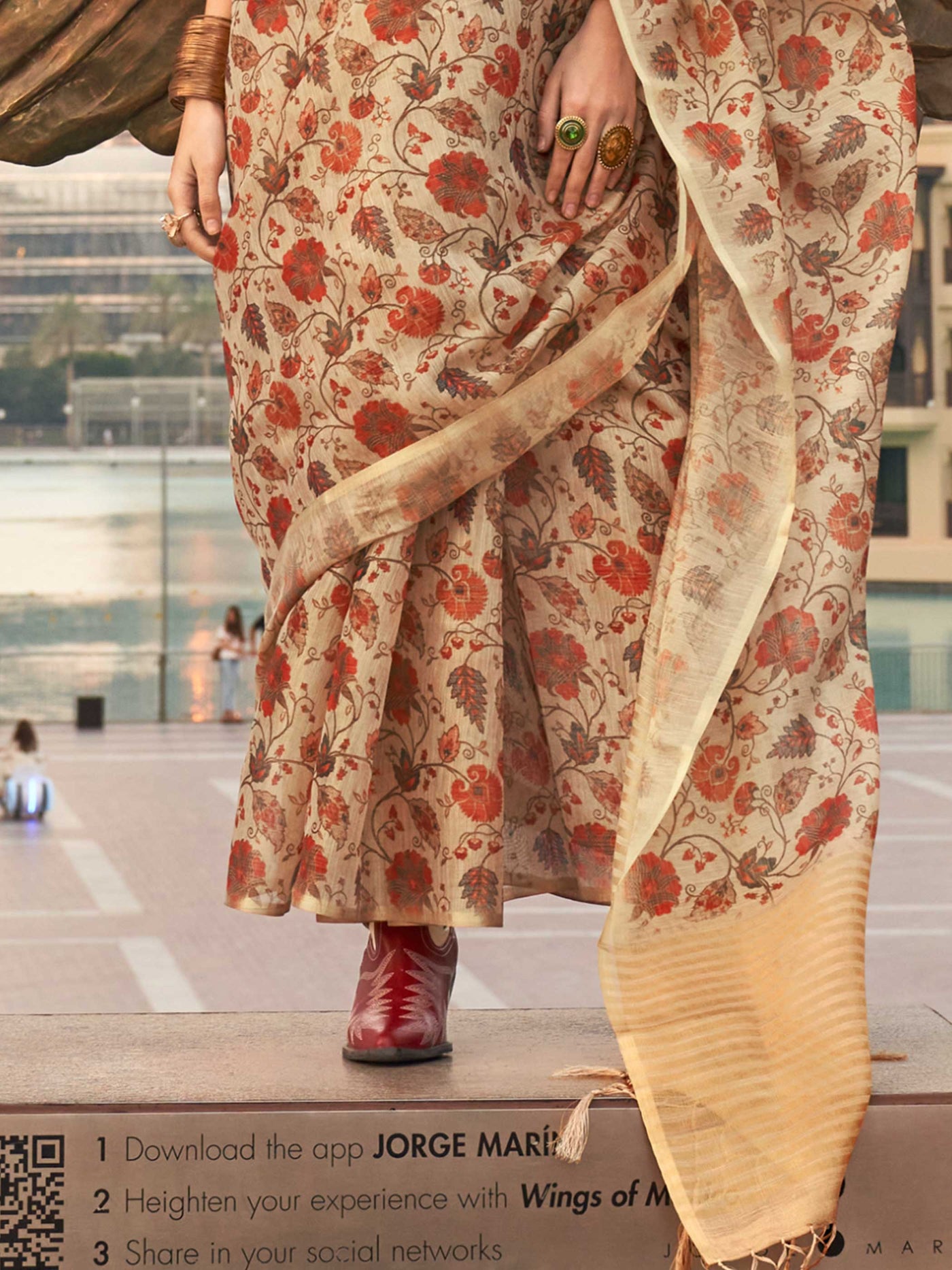 Beige and Golden zari tissue saree with printed floral motifs and zari pallu This image captures the back drape focus revealing pallu finesse and motif richness, ideal for visualizing festive elegance, designer appeal, and modern styling inspiration. Perfect for online shoppers seeking detailed previews before purchase, enhancing saree visual merchandising and SEO-rich product display strategy.                                                                                                                   