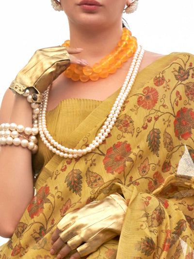 Yellow and Burnt Orange zari tissue saree with printed floral motifs and zari pallu This image captures the zoomed texture view illustrating fabric weave and print clarity, ideal for visualizing festive elegance, designer appeal, and modern styling inspiration. Perfect for online shoppers seeking detailed previews before purchase, enhancing saree visual merchandising and SEO-rich product display strategy.                                                                                                        