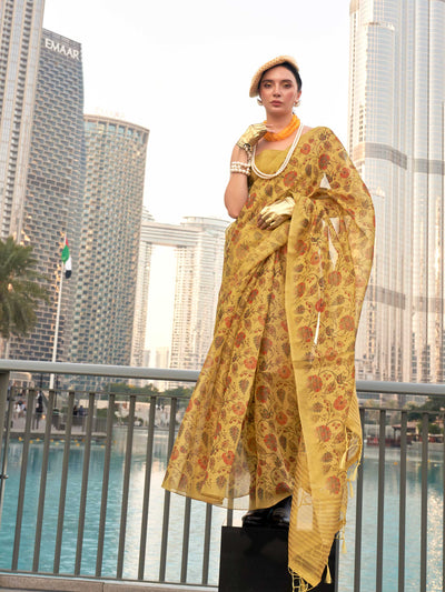 Yellow and Burnt Orange zari tissue saree with printed floral motifs and zari pallu This image captures the front drape view highlighting pallu fall and pleats alignment, ideal for visualizing festive elegance, designer appeal, and modern styling inspiration. Perfect for online shoppers seeking detailed previews before purchase, enhancing saree visual merchandising and SEO-rich product display strategy.                                                                                                          