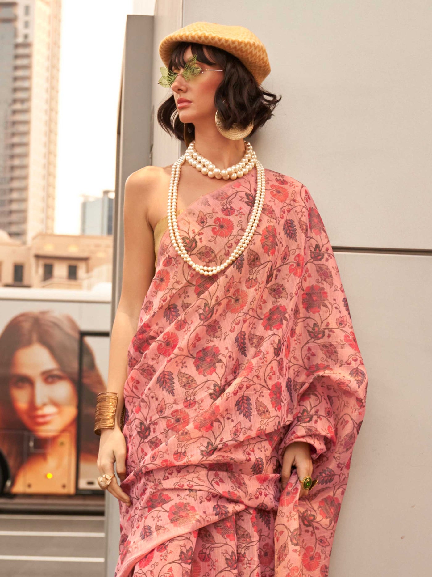 Blush Pink and Rose Gold zari tissue saree with printed floral motifs and zari pallu This image captures the side angle view showcasing blouse styling and zari border detail, ideal for visualizing festive elegance, designer appeal, and modern styling inspiration. Perfect for online shoppers seeking detailed previews before purchase, enhancing saree visual merchandising and SEO-rich product display strategy.                                                                                                      