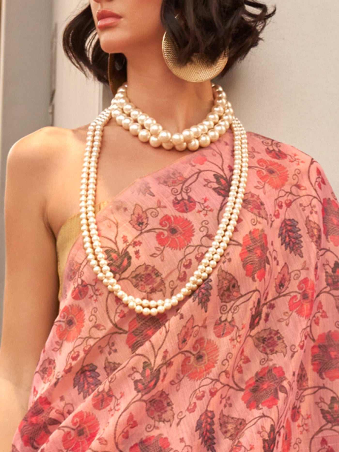 Blush Pink and Rose Gold zari tissue saree with printed floral motifs and zari pallu This image captures the zoomed texture view illustrating fabric weave and print clarity, ideal for visualizing festive elegance, designer appeal, and modern styling inspiration. Perfect for online shoppers seeking detailed previews before purchase, enhancing saree visual merchandising and SEO-rich product display strategy.                                                                                                       
