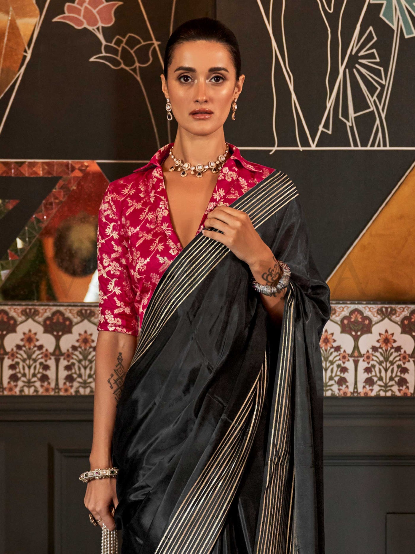 This elegant saree features a subtle all-over zari weave that sparkles under soft lighting, ideal for formal celebrations and festive occasions