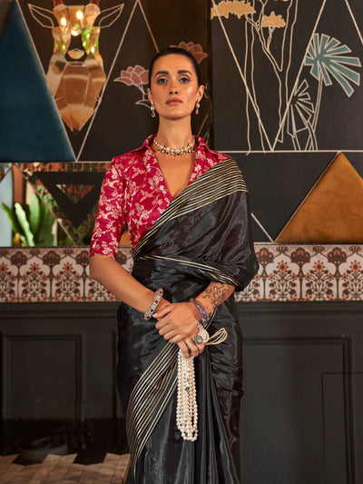 Styled with a matching heavy viscose blouse that adds structure and contrast to the drape, this saree is perfect for evening receptions, Diwali parties, or traditional engagements