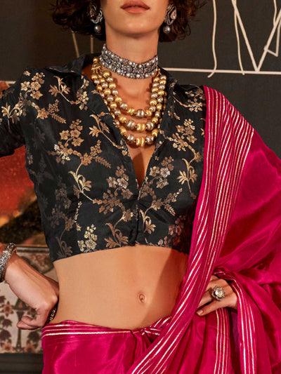 This saree pairs well with metallic jewelry and soft curls or a sleek bun