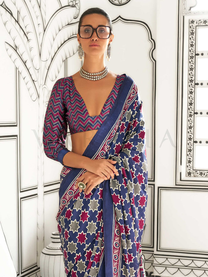 Navy Blue and Red-Ivory satin crepe saree with ajrakh digital print, soft texture and festive drape This image captures the back drape focus revealing pallu finesse and motif richness, ideal for visualizing festive elegance, designer appeal, and modern styling inspiration. Perfect for online shoppers seeking detailed previews before purchase, enhancing saree visual merchandising and SEO-rich product display strategy.                                                                                            