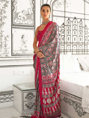 Red and Black-White satin crepe saree with ajrakh digital print, soft texture and festive drape This image captures the front drape view highlighting pallu fall and pleats alignment, ideal for visualizing festive elegance, designer appeal, and modern styling inspiration. Perfect for online shoppers seeking detailed previews before purchase, enhancing saree visual merchandising and SEO-rich product display strategy.                                                                                              