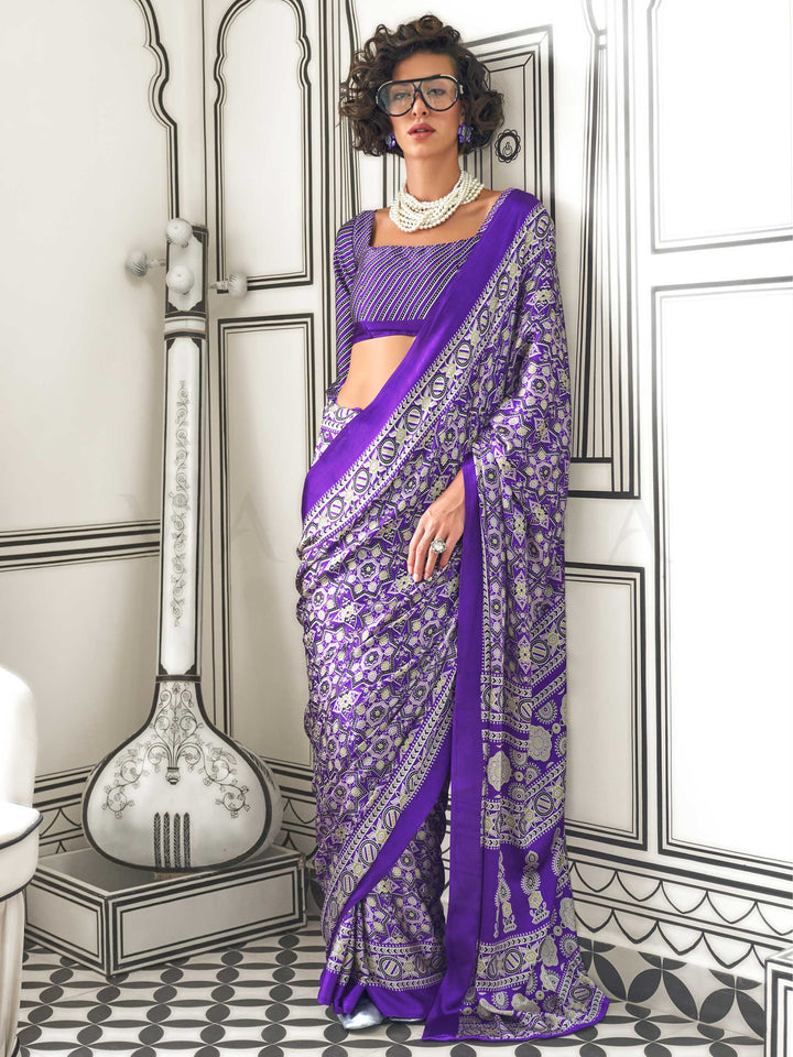 Purple and Silver satin crepe saree with ajrakh digital print, soft texture and festive drape This image captures the front drape view highlighting pallu fall and pleats alignment, ideal for visualizing festive elegance, designer appeal, and modern styling inspiration. Perfect for online shoppers seeking detailed previews before purchase, enhancing saree visual merchandising and SEO-rich product display strategy.                                                                                                