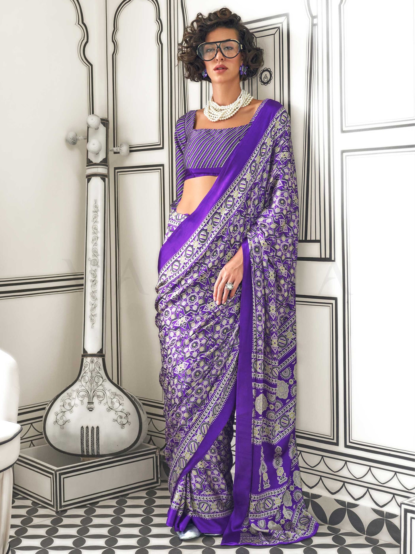 Purple and Silver satin crepe saree with ajrakh digital print, soft texture and festive drape This image captures the front drape view highlighting pallu fall and pleats alignment, ideal for visualizing festive elegance, designer appeal, and modern styling inspiration. Perfect for online shoppers seeking detailed previews before purchase, enhancing saree visual merchandising and SEO-rich product display strategy.                                                                                                