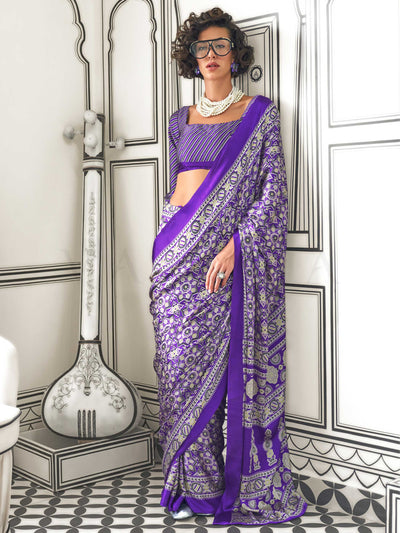 Purple and Silver satin crepe saree with ajrakh digital print, soft texture and festive drape This image captures the front drape view highlighting pallu fall and pleats alignment, ideal for visualizing festive elegance, designer appeal, and modern styling inspiration. Perfect for online shoppers seeking detailed previews before purchase, enhancing saree visual merchandising and SEO-rich product display strategy.                                                                                                