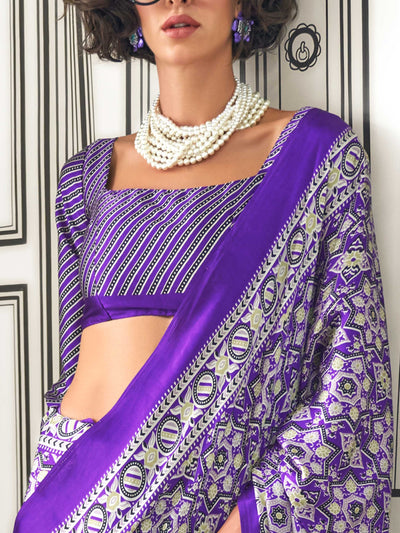 Purple and Silver satin crepe saree with ajrakh digital print, soft texture and festive drape This image captures the side angle view showcasing blouse styling and zari border detail, ideal for visualizing festive elegance, designer appeal, and modern styling inspiration. Perfect for online shoppers seeking detailed previews before purchase, enhancing saree visual merchandising and SEO-rich product display strategy.                                                                                             