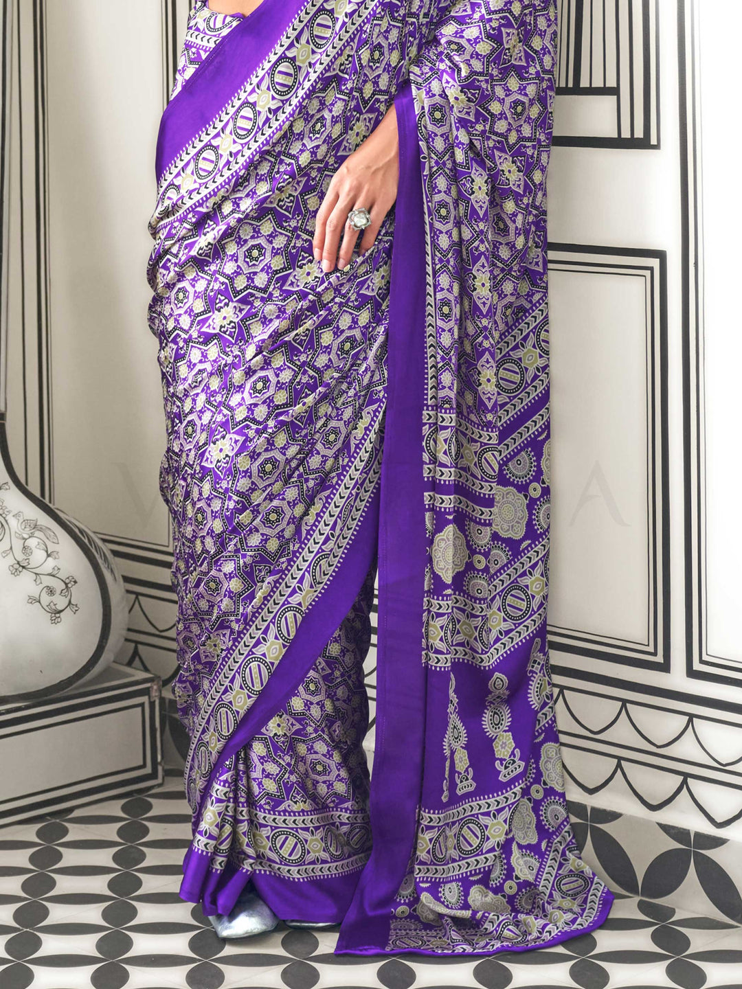 Purple and Silver satin crepe saree with ajrakh digital print, soft texture and festive drape This image captures the back drape focus revealing pallu finesse and motif richness, ideal for visualizing festive elegance, designer appeal, and modern styling inspiration. Perfect for online shoppers seeking detailed previews before purchase, enhancing saree visual merchandising and SEO-rich product display strategy.                                                                                                  