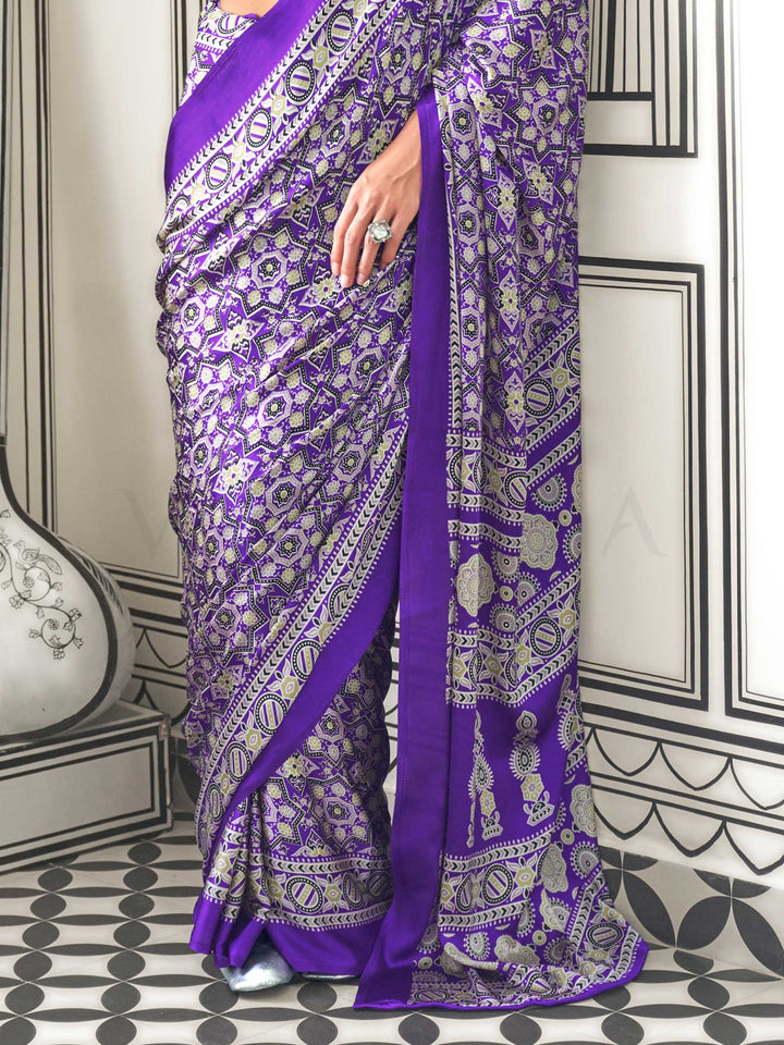 Purple and Silver satin crepe saree with ajrakh digital print, soft texture and festive drape This image captures the back drape focus revealing pallu finesse and motif richness, ideal for visualizing festive elegance, designer appeal, and modern styling inspiration. Perfect for online shoppers seeking detailed previews before purchase, enhancing saree visual merchandising and SEO-rich product display strategy.                                                                                                  