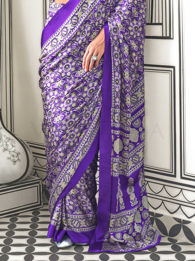Purple and Silver satin crepe saree with ajrakh digital print, soft texture and festive drape This image captures the back drape focus revealing pallu finesse and motif richness, ideal for visualizing festive elegance, designer appeal, and modern styling inspiration. Perfect for online shoppers seeking detailed previews before purchase, enhancing saree visual merchandising and SEO-rich product display strategy.                                                                                                  