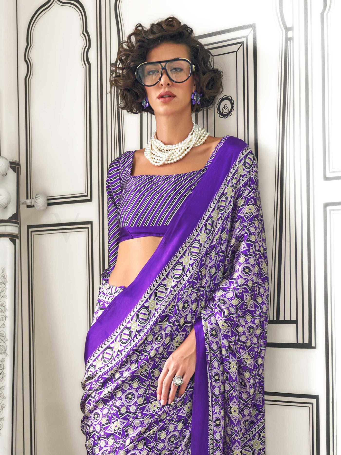 Purple and Silver satin crepe saree with ajrakh digital print, soft texture and festive drape This image captures the zoomed texture view illustrating fabric weave and print clarity, ideal for visualizing festive elegance, designer appeal, and modern styling inspiration. Perfect for online shoppers seeking detailed previews before purchase, enhancing saree visual merchandising and SEO-rich product display strategy.                                                                                              