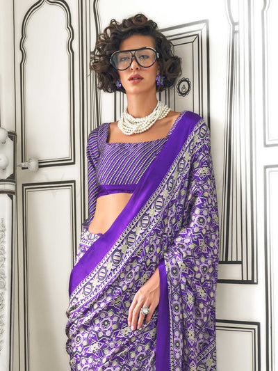 Purple and Silver satin crepe saree with ajrakh digital print, soft texture and festive drape This image captures the zoomed texture view illustrating fabric weave and print clarity, ideal for visualizing festive elegance, designer appeal, and modern styling inspiration. Perfect for online shoppers seeking detailed previews before purchase, enhancing saree visual merchandising and SEO-rich product display strategy.                                                                                              