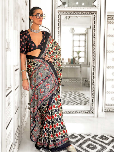 Black and Olive-Red satin crepe saree with ajrakh digital print, soft texture and festive drape This image captures the front drape view highlighting pallu fall and pleats alignment, ideal for visualizing festive elegance, designer appeal, and modern styling inspiration. Perfect for online shoppers seeking detailed previews before purchase, enhancing saree visual merchandising and SEO-rich product display strategy.                                                                                              
