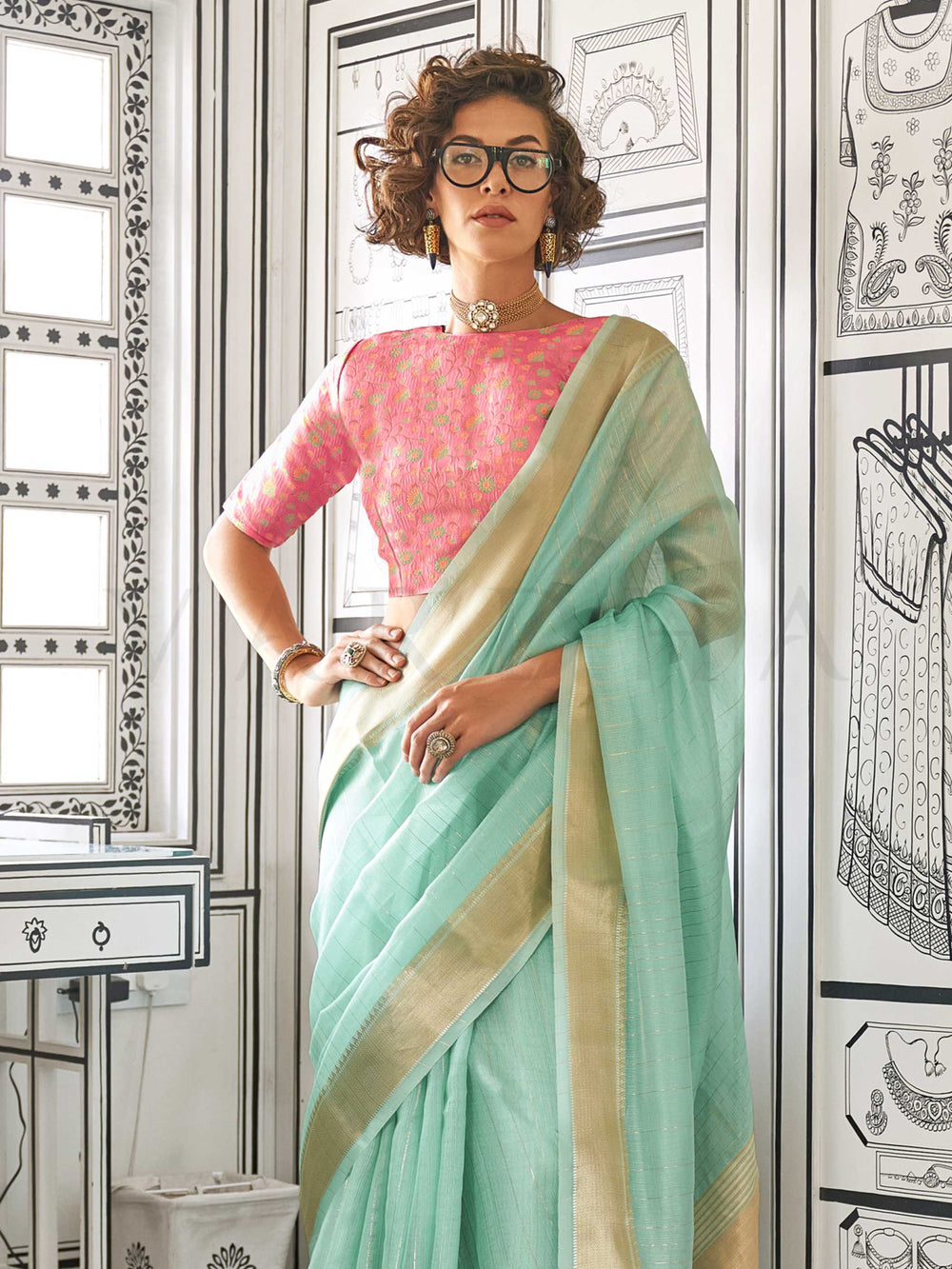 Mint Green moss chiffon saree styled for front profile This image captures the side angle view showcasing blouse styling and zari border detail, ideal for visualizing festive elegance, designer appeal, and modern styling inspiration. Perfect for online shoppers seeking detailed previews before purchase, enhancing saree visual merchandising and SEO-rich product display strategy.                                                                                                                                    