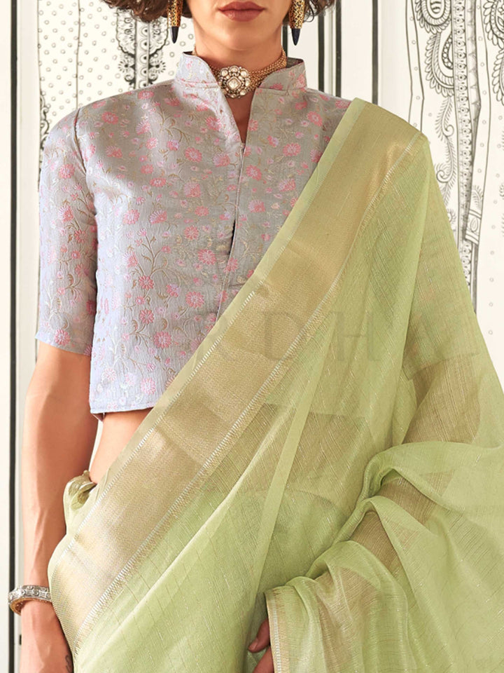 Pista Green moss chiffon saree styled for front profile This image captures the zoomed texture view illustrating fabric weave and print clarity, ideal for visualizing festive elegance, designer appeal, and modern styling inspiration. Perfect for online shoppers seeking detailed previews before purchase, enhancing saree visual merchandising and SEO-rich product display strategy.                                                                                                                                    