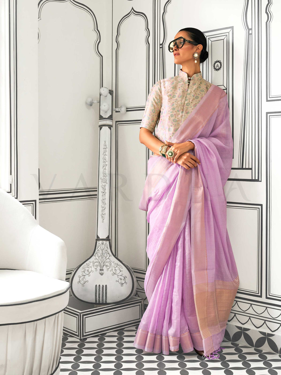 Lavender moss chiffon saree styled for front profile This image captures the front drape view highlighting pallu fall and pleats alignment, ideal for visualizing festive elegance, designer appeal, and modern styling inspiration. Perfect for online shoppers seeking detailed previews before purchase, enhancing saree visual merchandising and SEO-rich product display strategy.                                                                                                                                         