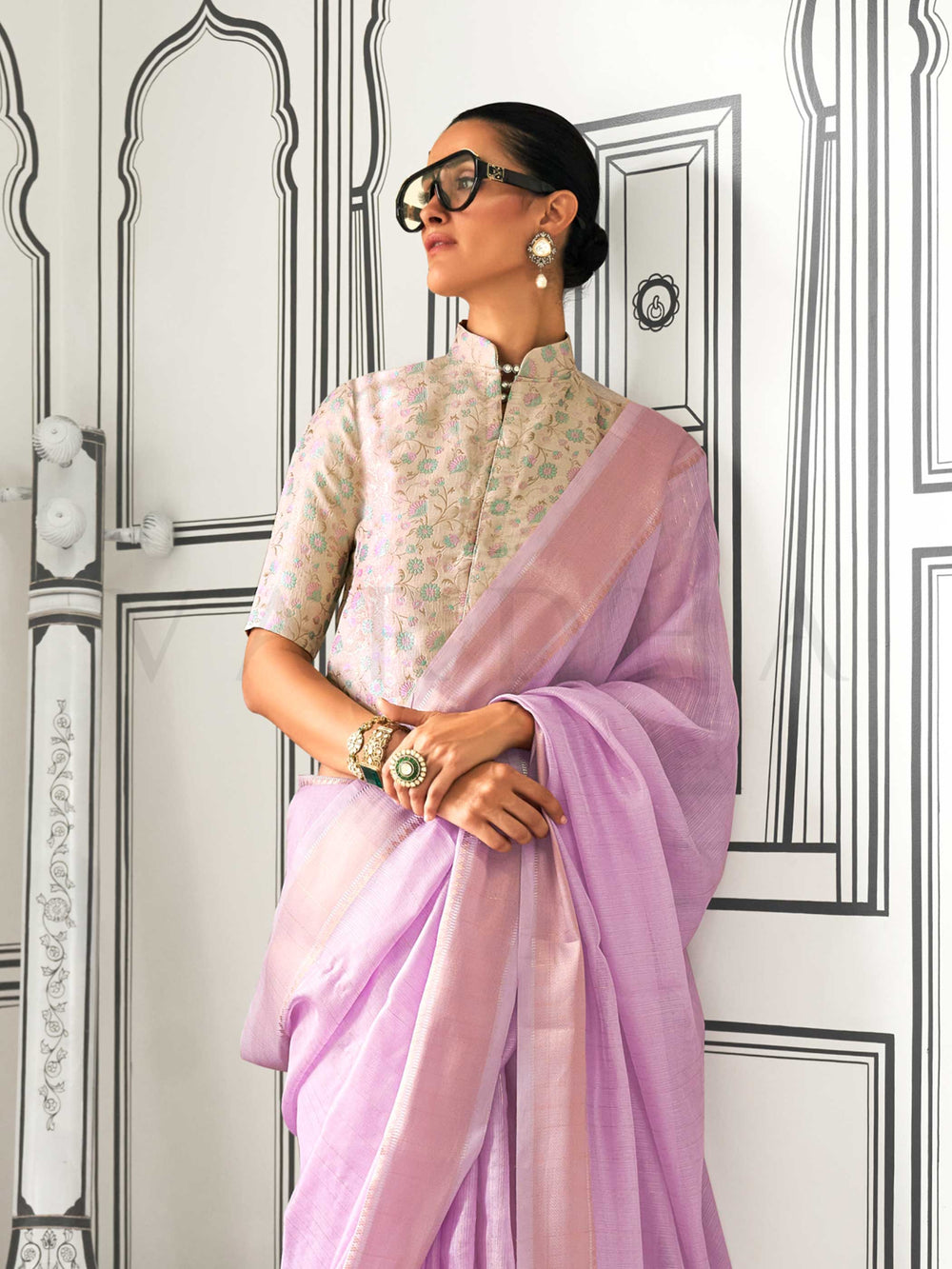 Lavender moss chiffon saree styled for front profile This image captures the side angle view showcasing blouse styling and zari border detail, ideal for visualizing festive elegance, designer appeal, and modern styling inspiration. Perfect for online shoppers seeking detailed previews before purchase, enhancing saree visual merchandising and SEO-rich product display strategy.                                                                                                                                      