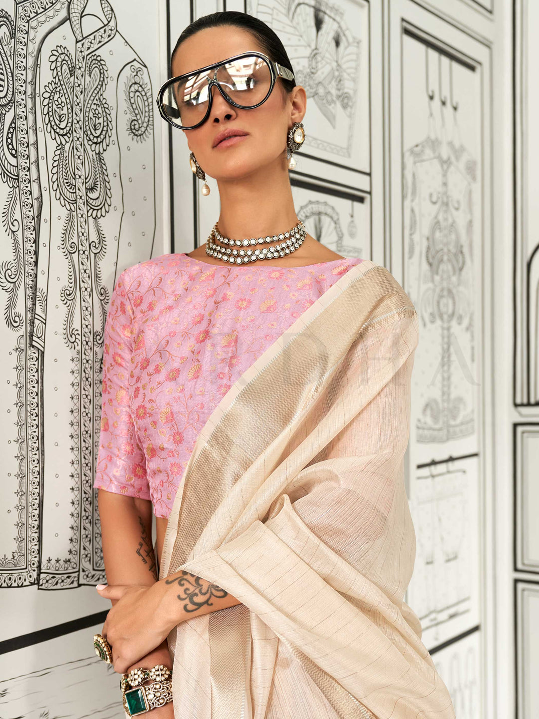 Ivory moss chiffon saree styled for front profile This image captures the model styling perspective with complete saree ensemble displayed, ideal for visualizing festive elegance, designer appeal, and modern styling inspiration. Perfect for online shoppers seeking detailed previews before purchase, enhancing saree visual merchandising and SEO-rich product display strategy.                                                                                                                                         
