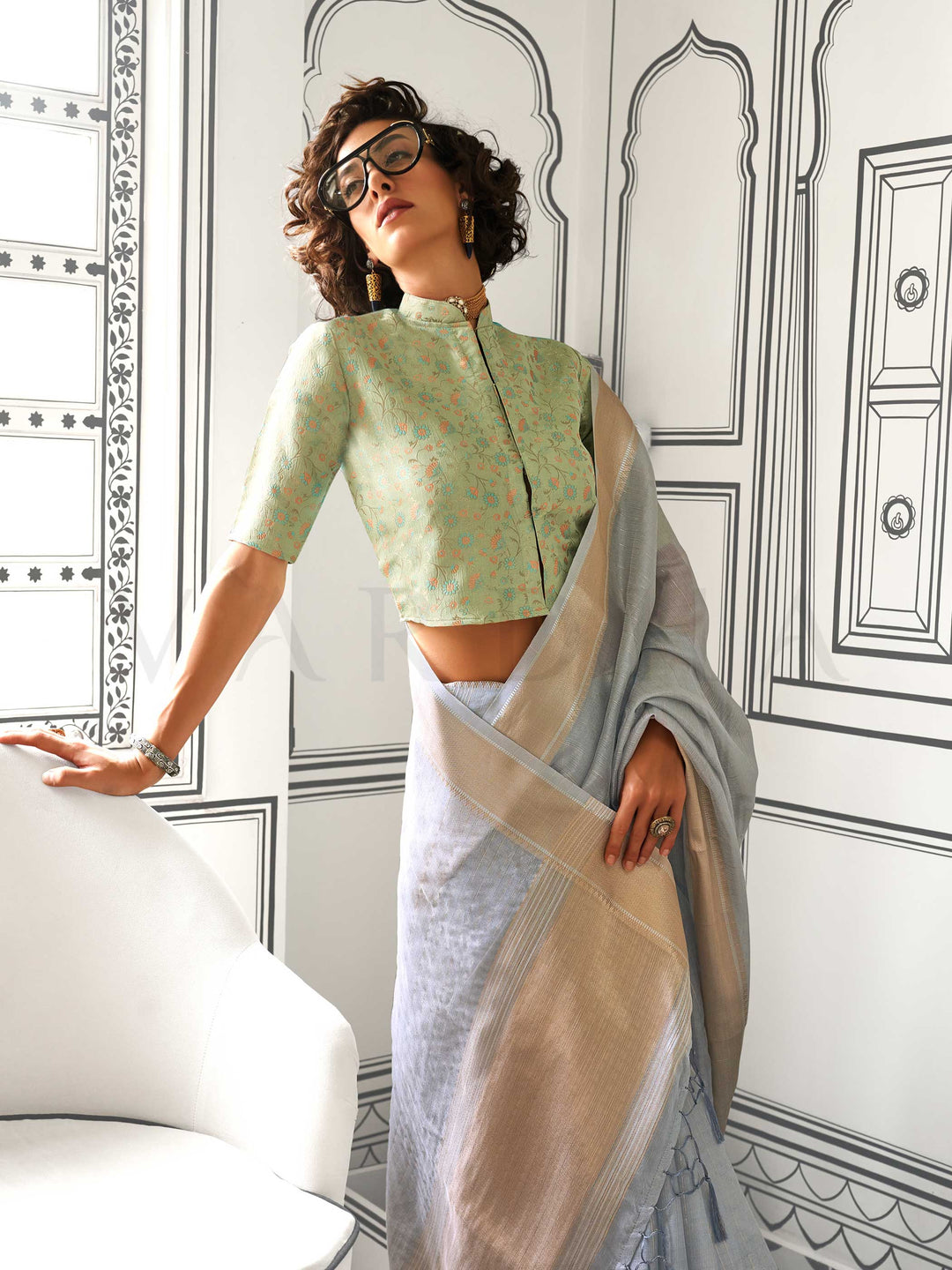 Smokey Blue moss chiffon saree styled for front profile This image captures the model styling perspective with complete saree ensemble displayed, ideal for visualizing festive elegance, designer appeal, and modern styling inspiration. Perfect for online shoppers seeking detailed previews before purchase, enhancing saree visual merchandising and SEO-rich product display strategy.                                                                                                                                   