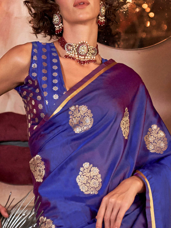 Royal Blue satin handloom silk saree with intricate brocade pallu, perfect for weddings and festive occasions This image captures the zoomed texture view illustrating fabric weave and print clarity, ideal for visualizing festive elegance, designer appeal, and modern styling inspiration. Perfect for online shoppers seeking detailed previews before purchase, enhancing saree visual merchandising and SEO-rich product display strategy.                                                                              