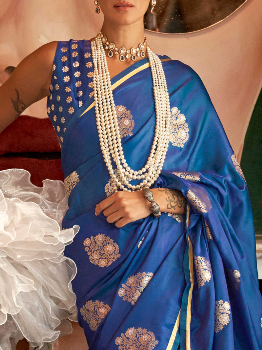 Sapphire Blue satin handloom silk saree with intricate brocade pallu, perfect for weddings and festive occasions This image captures the zoomed texture view illustrating fabric weave and print clarity, ideal for visualizing festive elegance, designer appeal, and modern styling inspiration. Perfect for online shoppers seeking detailed previews before purchase, enhancing saree visual merchandising and SEO-rich product display strategy.                                                                           
