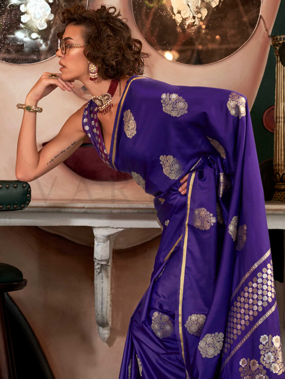 Violet Purple satin handloom silk saree with intricate brocade pallu, perfect for weddings and festive occasions This image captures the side angle view showcasing blouse styling and zari border detail, ideal for visualizing festive elegance, designer appeal, and modern styling inspiration. Perfect for online shoppers seeking detailed previews before purchase, enhancing saree visual merchandising and SEO-rich product display strategy.                                                                          