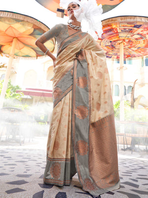 Ivory–Slate Grey satin silk saree featuring woven zari mandala motifs, contrast pallu and elegant festive finish. Festive Ivory–Slate Grey saree in soft satin silk with intricate weaving and a graceful two-tone blend.