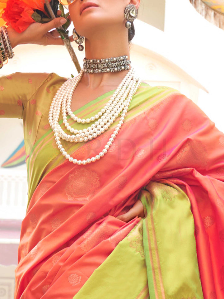 Charming Sunset Coral–Pista Green satin saree with textured pallu and timeless weaving artistry. Traditional-meets-modern in this Sunset Coral–Pista Green saree with zari borders and vibrant festival palette.