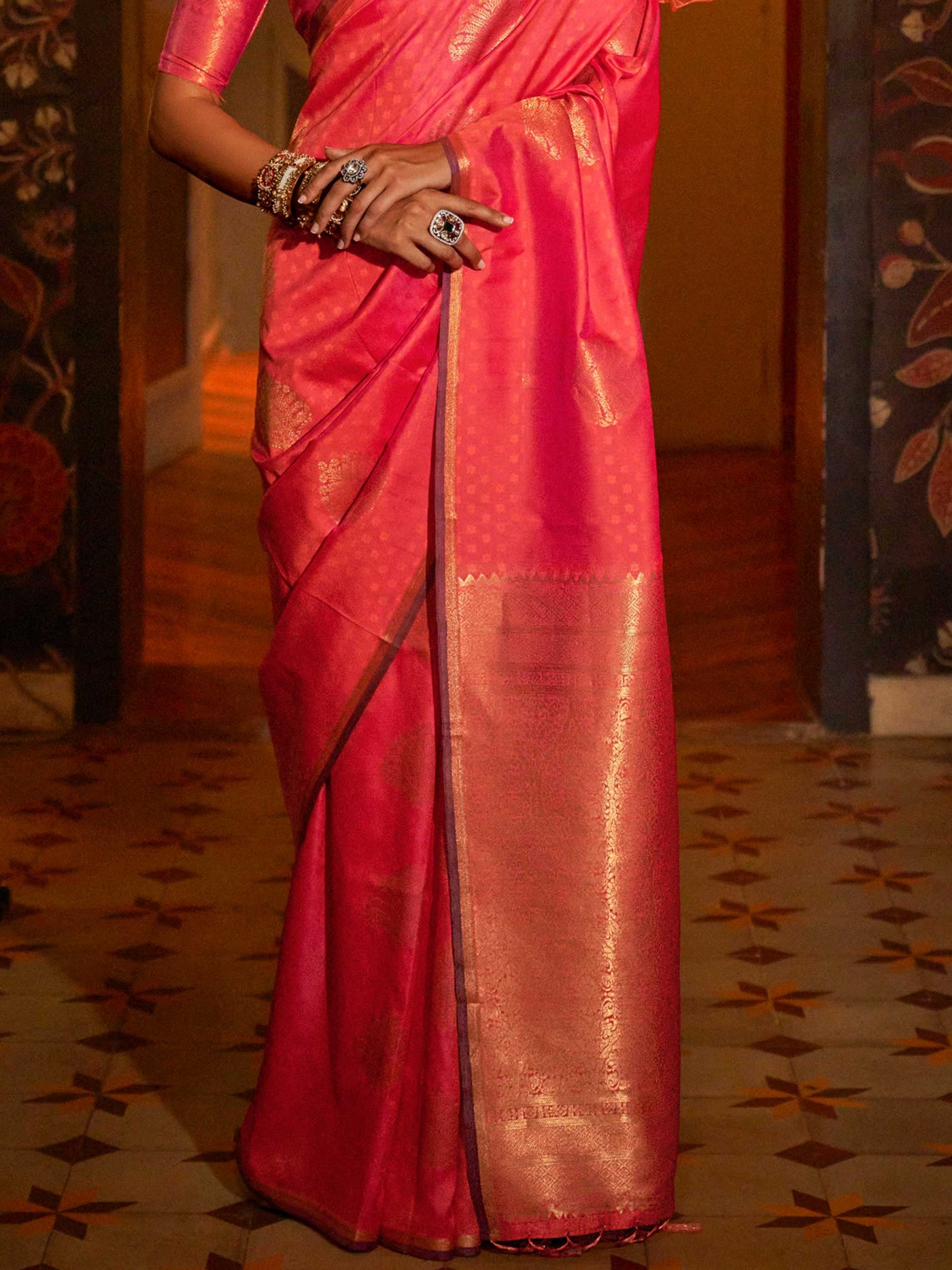 Banarasi satin saree in Peacock Blue–Gold styled with heirloom jewelry and festive decor. Ornate pallu with golden motifs set against Peacock Blue–Gold satin silk for regal presence..
