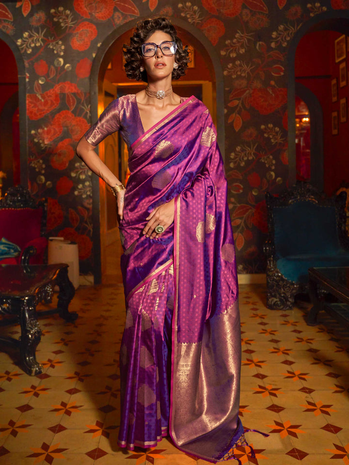 Rani Pink–Gold banarasi satin silk saree with rich woven zari work and golden pallu styled for weddings. Model in Rani Pink–Gold silk saree featuring temple-inspired zari buta and traditional border..