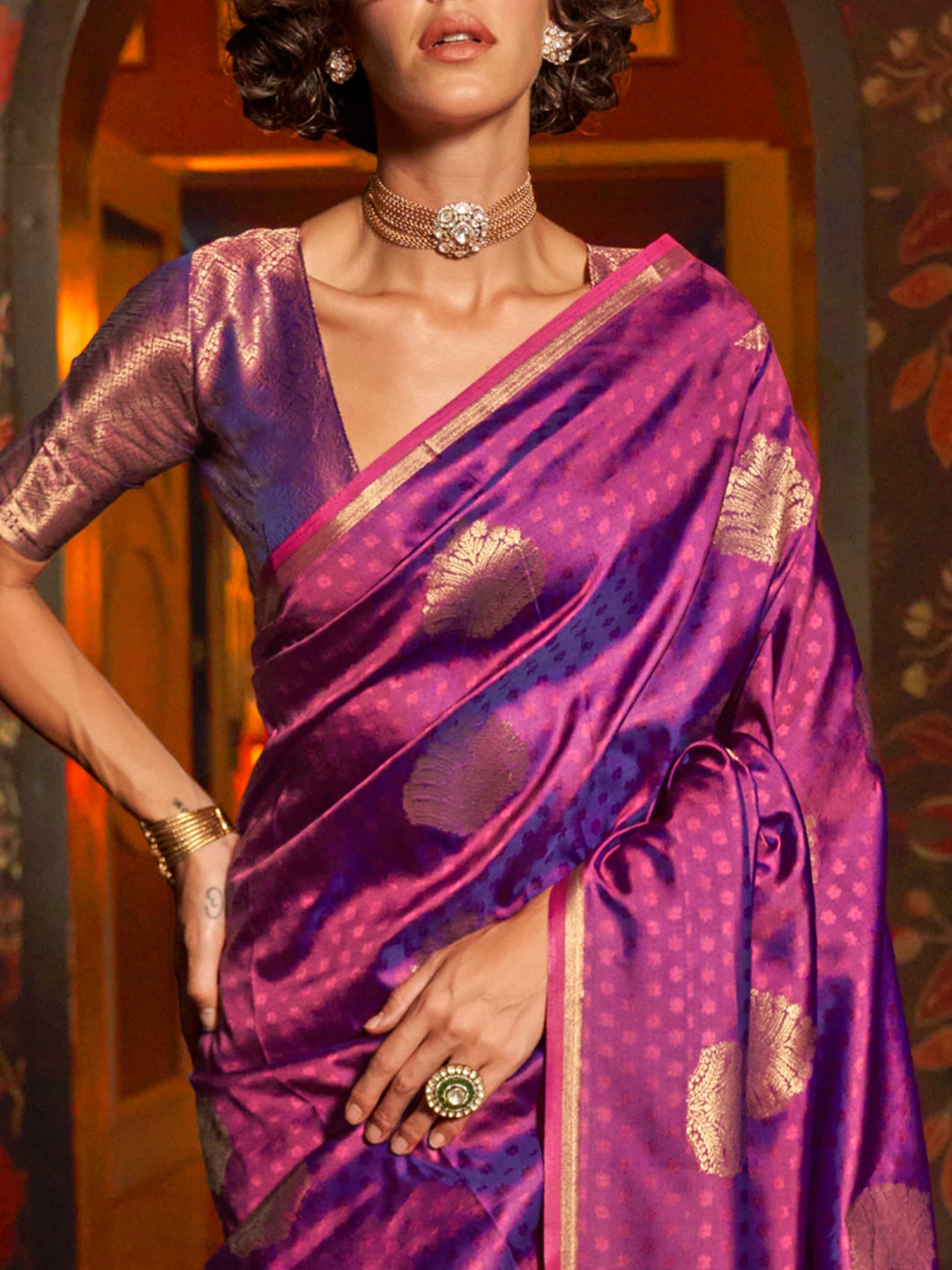 Rani Pink–Gold silk saree photographed in heritage setting with antique floor and floral wallpaper. Back fall view showing the dramatic zari pallu and matched blouse of Rani Pink–Gold saree..