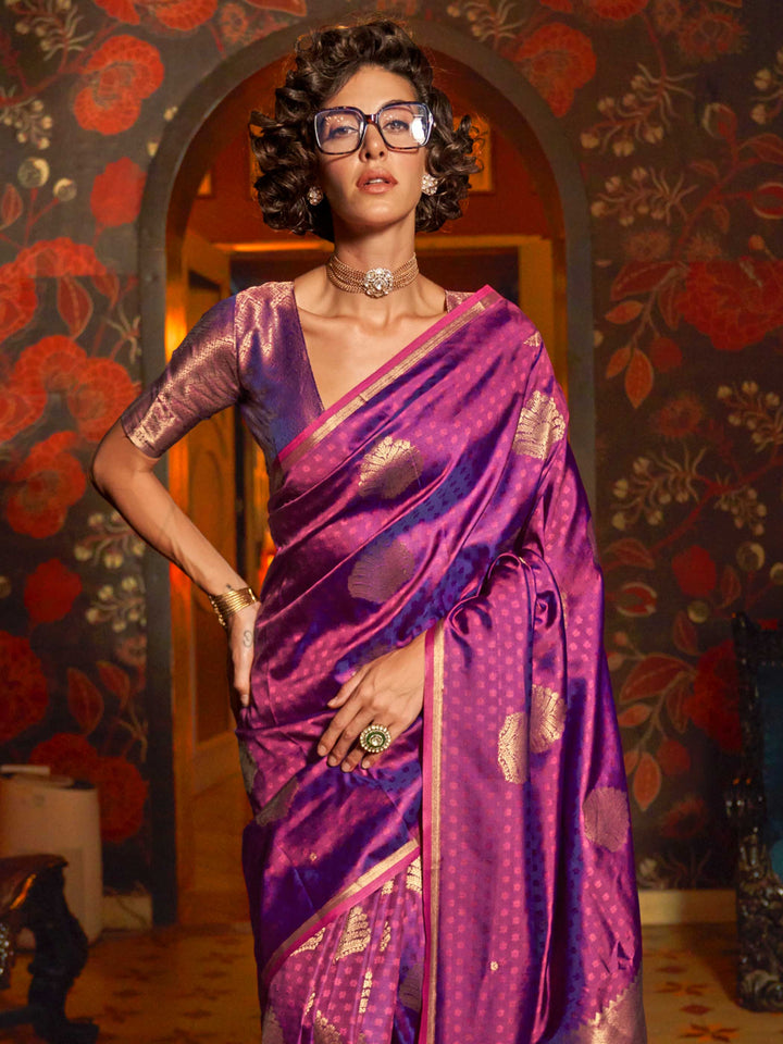 Soft satin silk texture and pleats of Rani Pink–Gold saree flowing into zari-drenched pallu. Close-up of zari woven motifs on Rani Pink–Gold banarasi saree with luxurious sheen..